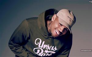 Chris Brown wearing a euphoric smile